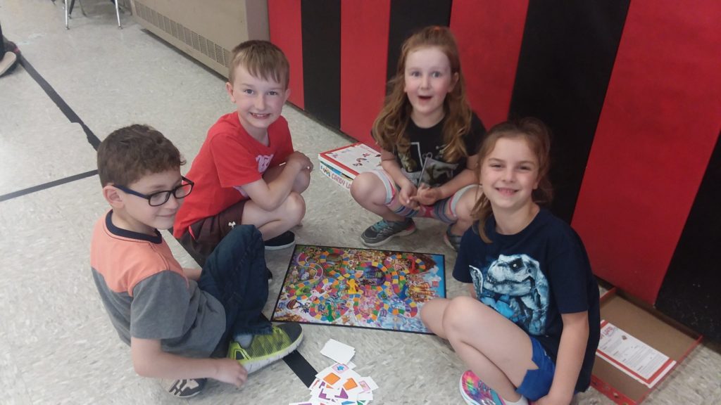 students playing with board games